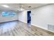 Spacious living room with new floors, modern fixtures, and large windows at 11201 Blendale Dr, Riverview, FL 33569