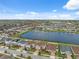 Overhead view of the neighborhood showcasing the community's layout with ponds, homes, and landscaping at 11544 Brighton Knoll Loop, Riverview, FL 33579
