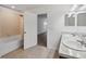 Bright bathroom with a shower-tub combo and double sink vanity at 11544 Brighton Knoll Loop, Riverview, FL 33579