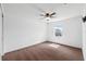 Carpeted bedroom with a ceiling fan and a window at 11544 Brighton Knoll Loop, Riverview, FL 33579