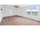 Large primary bedroom with carpet, ceiling fan, and views of the water at 11544 Brighton Knoll Loop, Riverview, FL 33579