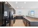 Modern kitchen featuring granite countertops, tile floors, stainless steel appliances and ample counter space at 11544 Brighton Knoll Loop, Riverview, FL 33579