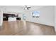 Open-concept living room with hardwood floors, seamlessly connected to the kitchen and offering ample space at 11544 Brighton Knoll Loop, Riverview, FL 33579
