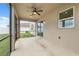 Screened in patio with ceiling fan and sliding glass doors at 11544 Brighton Knoll Loop, Riverview, FL 33579