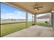 Spacious screened-in patio offering serene views of the lake and community at 11544 Brighton Knoll Loop, Riverview, FL 33579