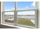 A picturesque window view of the pond behind the house at 11544 Brighton Knoll Loop, Riverview, FL 33579