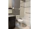 Bathroom with a granite countertop vanity, and a shower-tub combo at 11648 Palmetto Pine St, Riverview, FL 33569