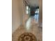 Hallway with decorative tile feature leading to the living area at 11648 Palmetto Pine St, Riverview, FL 33569