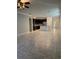 Open-concept living area with tile flooring, kitchen with an island, and ample space for entertaining and relaxation at 11648 Palmetto Pine St, Riverview, FL 33569