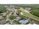 Aerial view of a neighborhood near a golf course with serene waterways, perfect for leisurely living at 11815 Marblehead Dr, Tampa, FL 33626