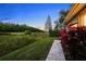 Beautifully landscaped backyard with lush greenery and serene views, creating a private oasis at 11815 Marblehead Dr, Tampa, FL 33626