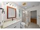 Bathroom featuring a glass shower, granite counters, and stylish lighting at 11815 Marblehead Dr, Tampa, FL 33626