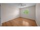 Bright bedroom featuring hardwood floors, a ceiling fan and natural light from a window at 11815 Marblehead Dr, Tampa, FL 33626