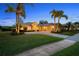 Charming home with a well-maintained lawn, mature palms, and a spacious three-car garage at 11815 Marblehead Dr, Tampa, FL 33626