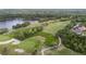 Scenic golf course with manicured greens, a serene lake, and tree-lined fairways, perfect for golfers at 11815 Marblehead Dr, Tampa, FL 33626