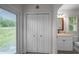 Hallway leading to a bathroom and outdoor access at 11815 Marblehead Dr, Tampa, FL 33626