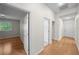 Hallway with doors leading to a bedroom and bath, highlighting the home's open layout at 11815 Marblehead Dr, Tampa, FL 33626