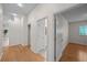 Hallway with hardwood flooring and views of other rooms at 11815 Marblehead Dr, Tampa, FL 33626
