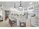 Spacious kitchen with white cabinetry, granite countertops, a center island and stainless appliances at 11815 Marblehead Dr, Tampa, FL 33626
