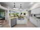 Bright kitchen featuring stainless appliances, granite countertops, and a convenient center island at 11815 Marblehead Dr, Tampa, FL 33626