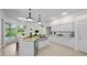 Beautiful kitchen showcasing stainless appliances, granite counters and tiled flooring at 11815 Marblehead Dr, Tampa, FL 33626