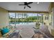 Covered lanai with pool, seating, and scenic views at 11815 Marblehead Dr, Tampa, FL 33626