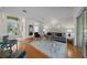 Well-lit living room featuring hardwood floors, stylish decor, and an open layout perfect for entertaining and relaxing at 11815 Marblehead Dr, Tampa, FL 33626