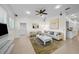 Inviting living room with plush seating, modern decor, and an open layout connecting to the kitchen at 11815 Marblehead Dr, Tampa, FL 33626