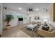 Relaxing living room with ample natural light, comfortable seating, and a view to the outdoors at 11815 Marblehead Dr, Tampa, FL 33626