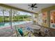 Relaxing screened-in patio with comfortable seating and pool views, perfect for outdoor entertaining at 11815 Marblehead Dr, Tampa, FL 33626
