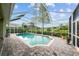 Inviting pool with a screen enclosure for year-round enjoyment and privacy at 11815 Marblehead Dr, Tampa, FL 33626
