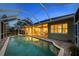 The covered pool offers a relaxing outdoor living space with a brick paver deck at 11815 Marblehead Dr, Tampa, FL 33626