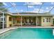Lush pool with a screened lanai and great lounge area and a calming ambiance at 11815 Marblehead Dr, Tampa, FL 33626