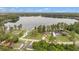 Lakeside community featuring well-maintained homes, mature trees, and direct access to a serene lake at 12651 Tinley Rd, New Port Richey, FL 34654