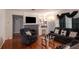 Comfortable living room with dark sofas and a fireplace featuring built-in shelves at 12651 Tinley Rd, New Port Richey, FL 34654