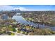 Scenic aerial view of waterfront townhomes with private docks along a calm river and city skyline at 1306 W Charter St, Tampa, FL 33602