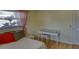 This bedroom offers a serene retreat with a quaint desk and soft, natural light at 1450 Highfield Dr, Clearwater, FL 33764