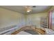 Bedroom with wood floors, ceiling fan, vanity, and lots of storage at 1450 Highfield Dr, Clearwater, FL 33764
