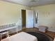 A functional bedroom with a stylish vanity area and convenient access to other rooms at 1450 Highfield Dr, Clearwater, FL 33764