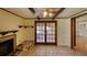 Comfortable living room with a ceiling fan and doors to the lanai at 1450 Highfield Dr, Clearwater, FL 33764