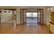 Living room with wood floors and double doors out to the lanai at 1450 Highfield Dr, Clearwater, FL 33764