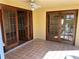 Outdoor patio featuring tiled flooring and access to the interior of the home via french doors at 1450 Highfield Dr, Clearwater, FL 33764