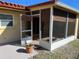 Screened in patio opens to the deck and backyard at 1450 Highfield Dr, Clearwater, FL 33764