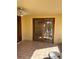 Covered porch with tile flooring and glass paneled doors, transitioning into the yard at 1450 Highfield Dr, Clearwater, FL 33764