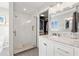 Bathroom featuring a glass enclosed shower, closet and updated vanity with marble countertop at 1472 47Th Ne Ave, St Petersburg, FL 33703