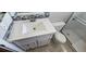 Bathroom features a stylish vanity with tile accents, toilet and walk-in shower at 1507 N Lake Dr, Sun City Center, FL 33573