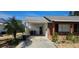 View of the brick home's attached carport and front entrance at 1507 N Lake Dr, Sun City Center, FL 33573