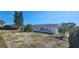 A charming home is surrounded by mature trees and greenery at 1507 N Lake Dr, Sun City Center, FL 33573