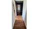 Hallway with hardwood flooring at 1507 N Lake Dr, Sun City Center, FL 33573