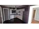Kitchen area features white appliances, ample counter space, and updated cabinets at 1507 N Lake Dr, Sun City Center, FL 33573